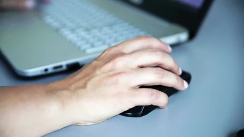 A female person using a lap-top mouse Stockbeeldmateriaal 156783712