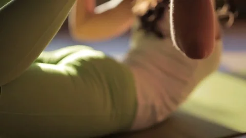 Female personal trainer doing asanas on matting in yogas centre Video stock 79684471