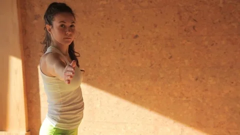 Female personal trainer doing asanas staying on matting in yogas studio Video stock 79686297