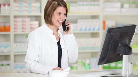 Female pharmacist using phone Stock-Footage 25210250