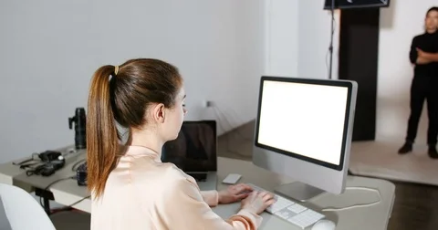 Female photographer reviewing captured photos in his digital camera Stock Footage