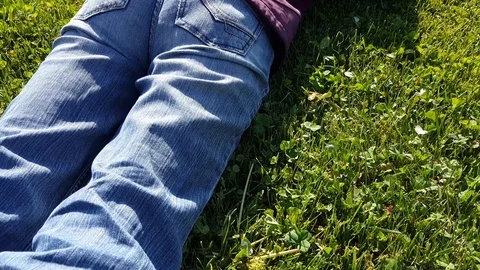 Female photographer using DSLR camera on grass Stock Footage 92691480