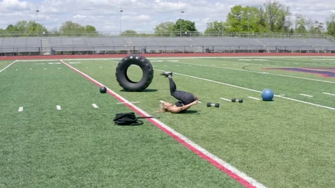 Female Physical Trainer Exercising Working Out Full Body Weights Aerial Drone Stock Footage 154384349