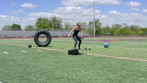 Female Physical Trainer Exercising Working Out Full Body Weights Aerial Drone 動画素材 154384368
