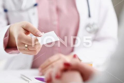 Female physician hand give white blank Stock Photos