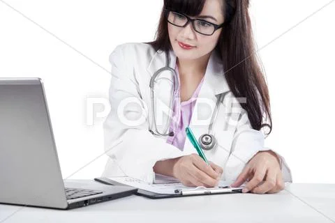 Female physician write medical report Stock Photos