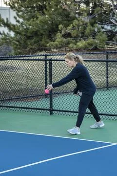 Female Pickleball Player Server Stock Photos