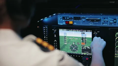 Female pilot sitting in chair, working inside of aircraft cabin. Stock Footage 234522541