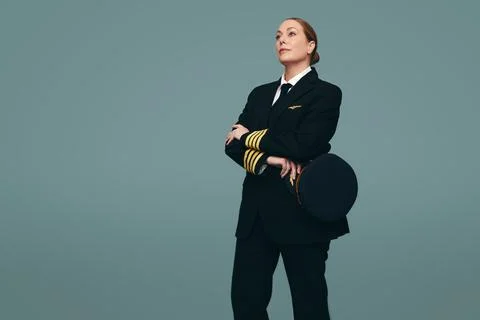 Female pilot standing in a studio Stock Photos