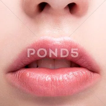 Female pink plump lips makeup Stock Photos