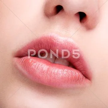 Female pink plump lips makeup Stock Photos