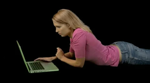 Female playing on laptop Stock Footage 9141068