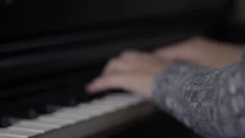 Female playing piano - closeup on hands - shallow depth of field - UNGRADED Stock Footage