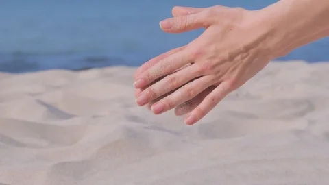 Female playing with white sand on beach Vídeo Stock 79709760