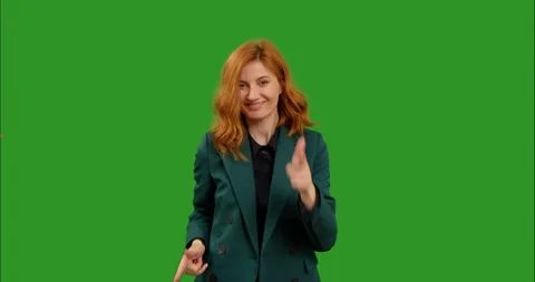 Female points at the camera and dances on green screen background . Stock Footage 295891512