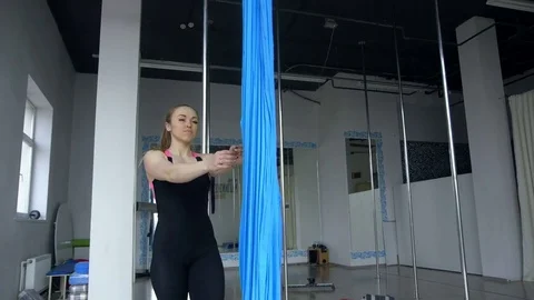 Female pole dancer wiping down dance pole before start dancing at night club 스톡 동영상 73226820