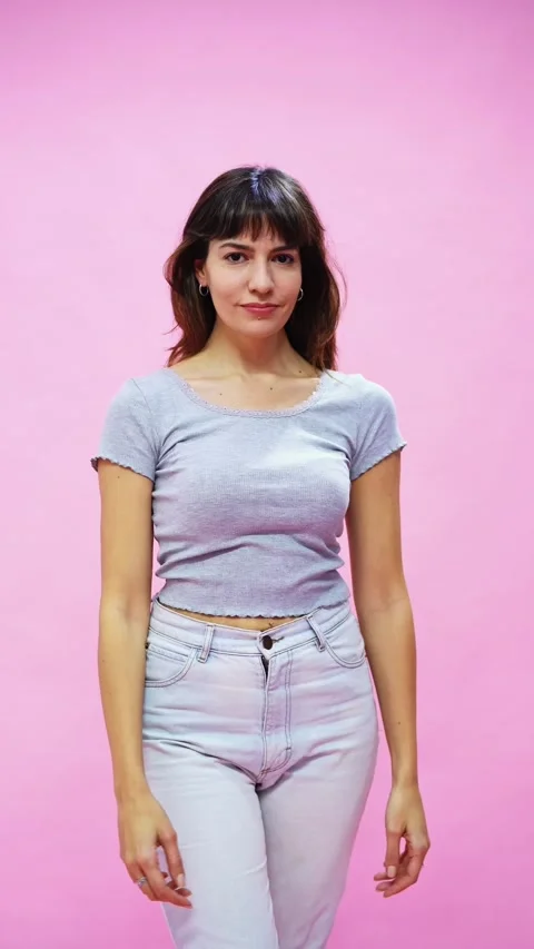 Female portrait on a solid pink background Video stock 316703700