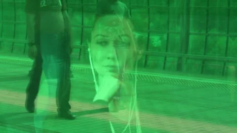 A female portrait through the window of a train standing in a green station. Stock Footage 146713210