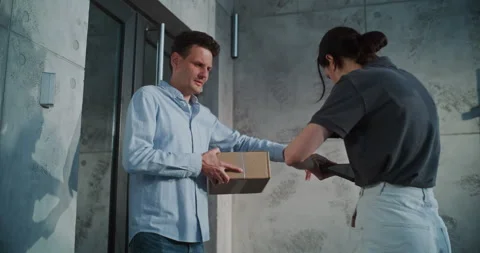 Female Postal Worker Delivering Parcel Box to Addressee, Getting Clients Stock Footage 312386378