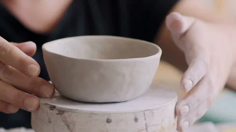 Female potter creating a bowl. Video stock 66774553