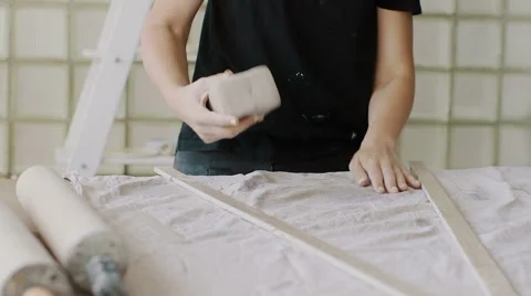 Female potter master preparing the clay on table. Stock Footage 66775558