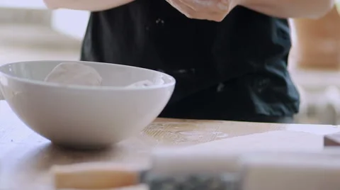 Female potter master preparing the clay on table. Stock Footage 66775881