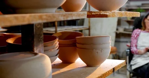 Female potter using digital tablet 4k Stock Footage 85325094