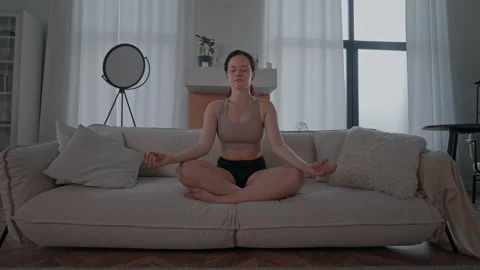 Female practice deep breathing and relaxation techniques Stock Footage 245490969