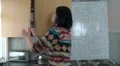 Female preparing dinner in a panic HD Footage