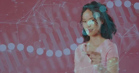 Female presenter moving pointer in pink studio, demonstrating tech DNA helix and Video stock 331048172