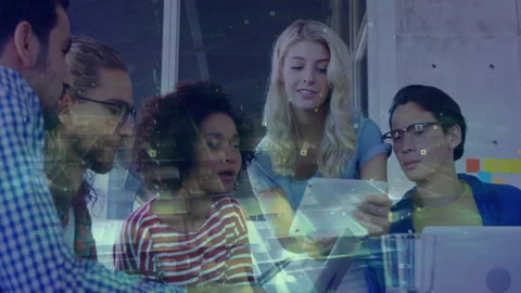 Female presenter tapping tablet turning virtual slides as team leaning, nodding Stock Footage 311962853