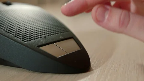 Female presses the button to speak desktop microphone in conference. Hand close 스톡 동영상 101796661