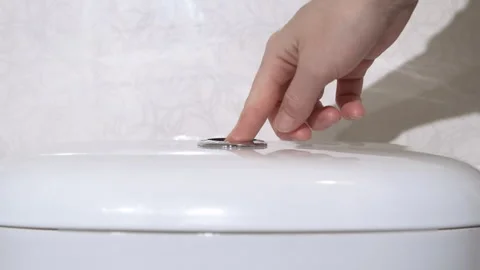 Female pressing the flush button. Video stock 280513395