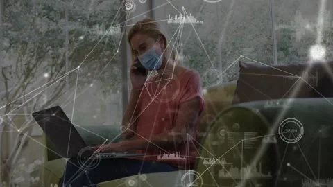 Female pro answering phone while typing on laptop and gesturing for work, tech Stock Footage 334182386