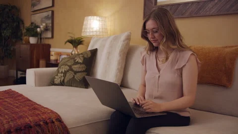 Female Professional Work From Home Study Remote on Couch Living Room 24fps Stock Footage 188031433