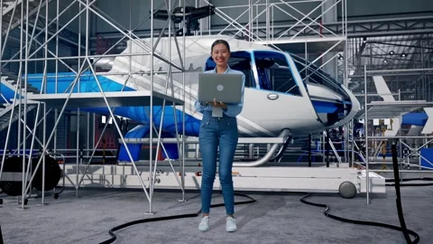 Female Professional Worker Smiling To Camera and Inspecting Helicopter Stock Footage 312127689