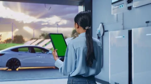 Female Professional Worker Use Green Screen Tablet With Energy Storage Stock Footage 295134814