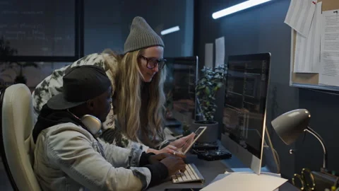 Female Programmer with Code on Tablet Consulting Male Colleague Stock Footage 273833874