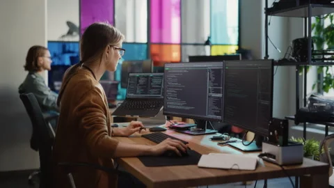 Female Programmer Codes on Desktop Computer in Office Video stock 223188616