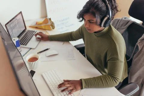 Female programmer coding on computer Stock Photos
