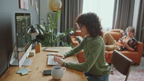 Female Programmer Coding on Computer as Working from Home Stock Footage 306459693