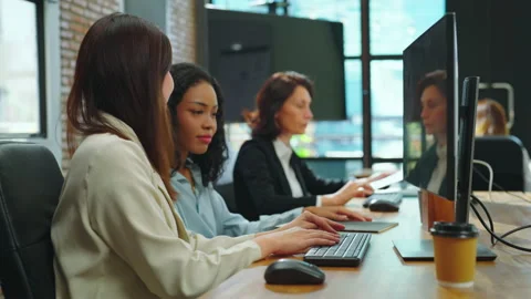 Female programmer coding her project while collaborating with her team. Stock Footage 234367924