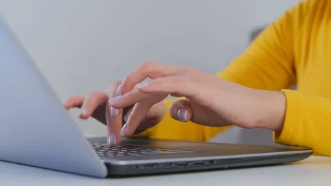 Female programmer coding on notebook computer at home in close up 4k video Stock Footage 225242125