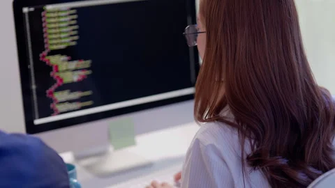 Female Programmer Coding Software on Desktop Computer Video stock 343622342