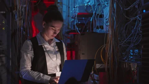 Female Programmer Coding in Switchboard Room Stock Footage 155676860