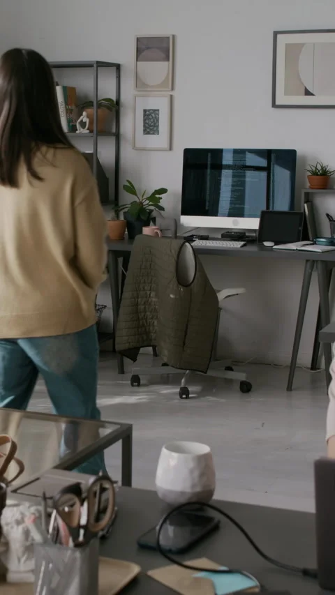 Female Programmer Coming back to Office Desk after Lunch Break Stock Footage 299200806