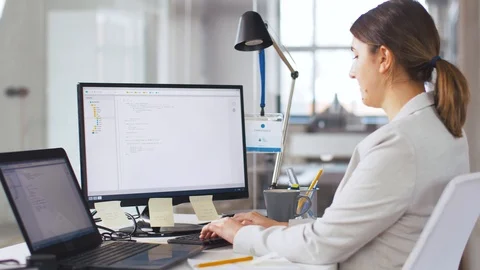 Female programmer with computer working at office Stock Footage 105029345