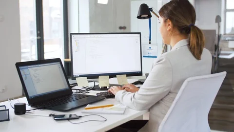 Female programmer with computer working at office Stock Footage 105031893
