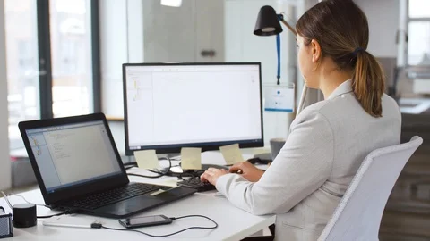 Female programmer with computer working at office Stock Footage 105032108