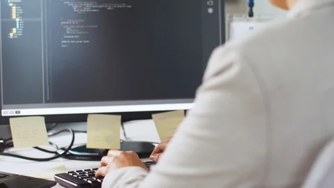 Female programmer with computer working at office Stock Footage 105418107